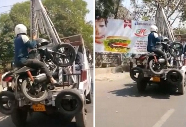 印度男子騎摩托車(chē)違停拒付罰款 人車(chē)一并被拖走